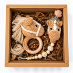 Handmade crochet horse baby rattle with yarn mane and matching horse pacifier holder in kraft gift box