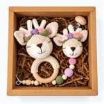 Floral reindeer crochet baby rattle and matching reindeer pacifier holder in kraft gift box