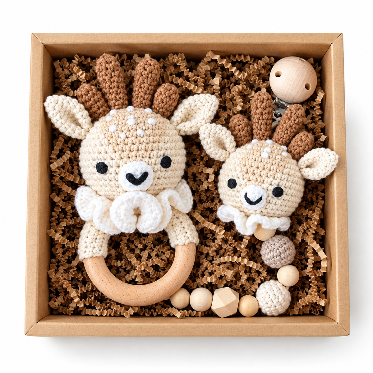 Deer crochet baby rattle and matching pacifier holder in a kraft gift box