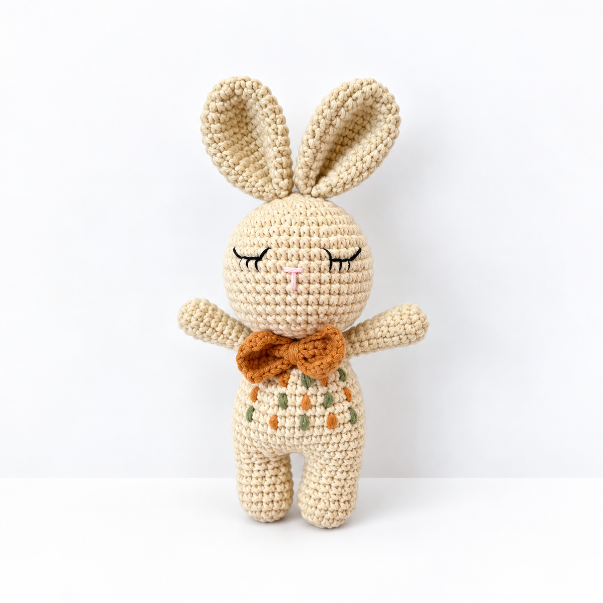 Mini Oliver handmade crochet bunny doll with caramel bow and embroidered outfit