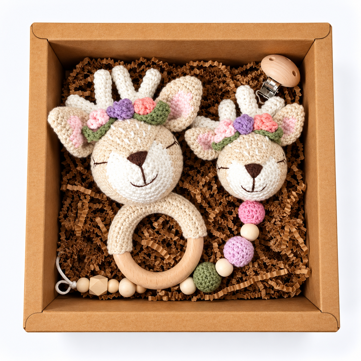 Floral reindeer crochet baby rattle and matching reindeer pacifier holder in kraft gift box