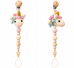 Fernando & James Unicorn Pacifier Holder with pastel crochet details and natural wood beads